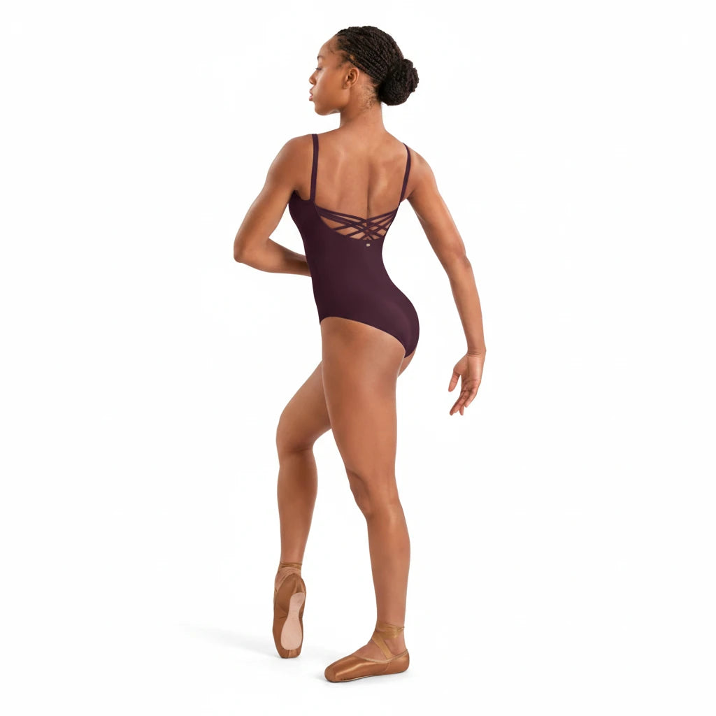 Dancer wearing a La Pointe Boutique Mirella merlot leotard with a cross-back design and scoop neckline